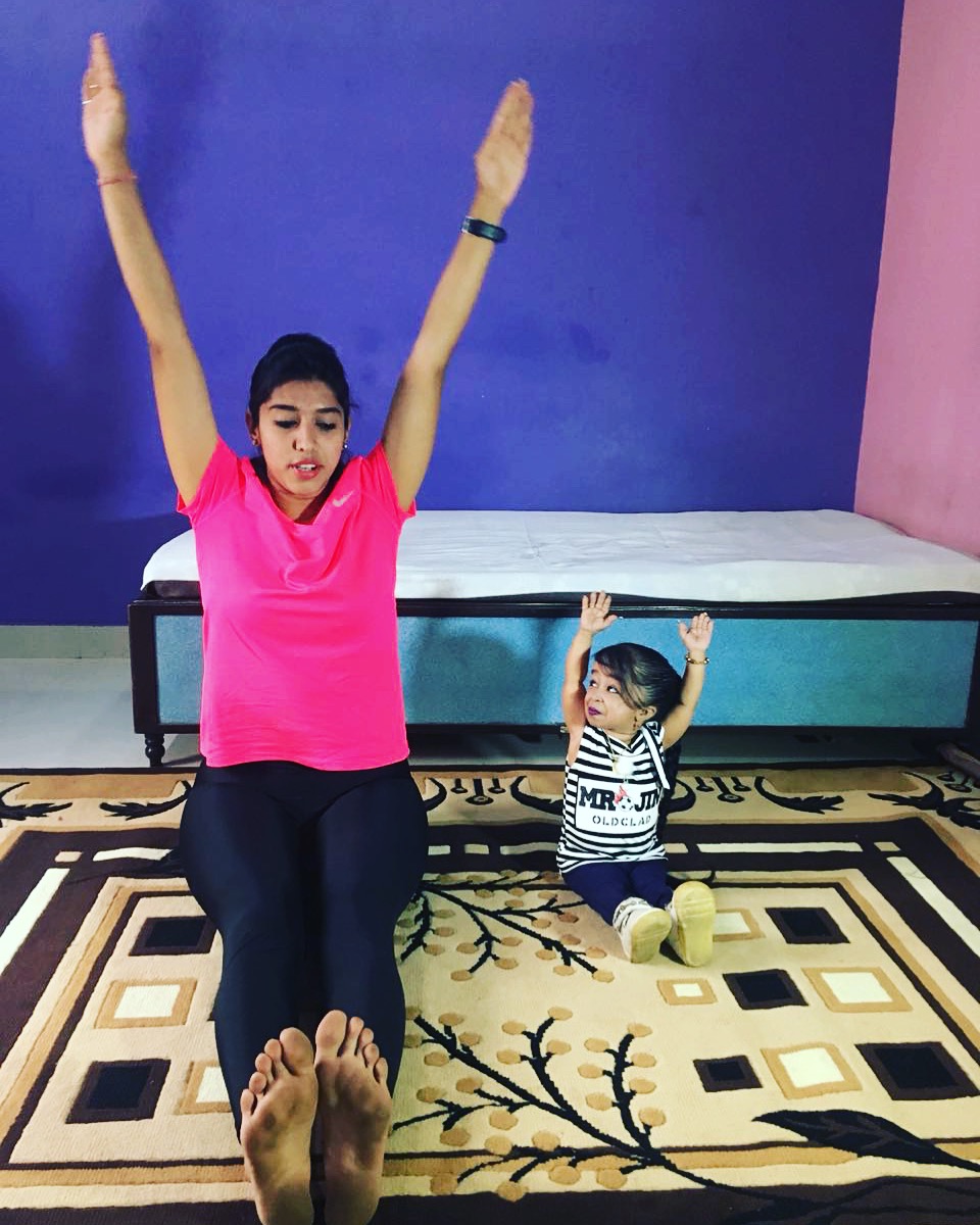 Jyoti Amge, (right) the world smallest living women performing yoga